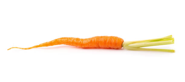 istock Fresh baby carrots isolated on a white background 991853622