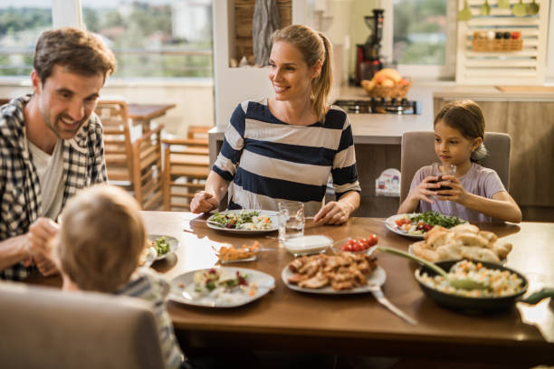 istock Happy family during lunch time in dining room. 991855994
