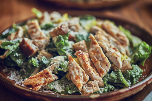 istock Homemade Cesar Salad with Chicken, Lettuce and Parmesan 991861832
