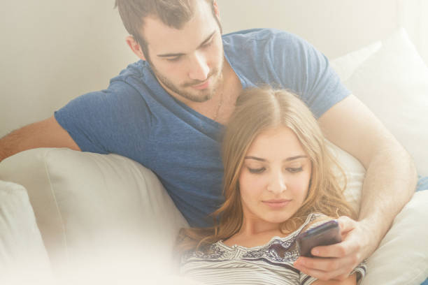 istock Young couple checking a smartphone 991862288