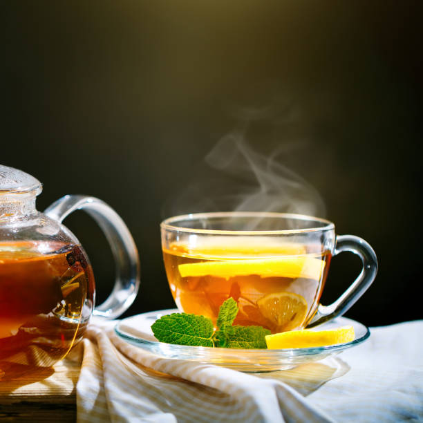 istock Cup of freshly brewed black tea,warm soft light, darker background 991866008
