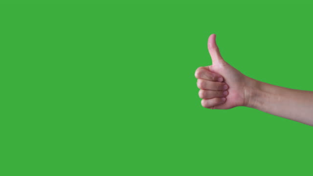 Hand gesturing like and dislike on green background
