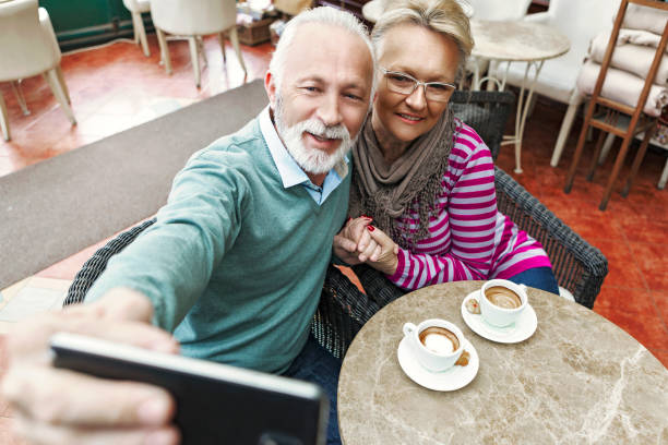 istock Senior couple taking selfie 991871972