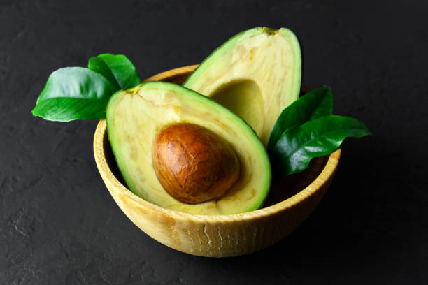 istock Fresh avocado fruit on a wooden board 991886810