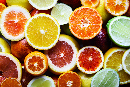 Mix of different citrus fruits closeup. Healthy diet vitamin concept. Food photography