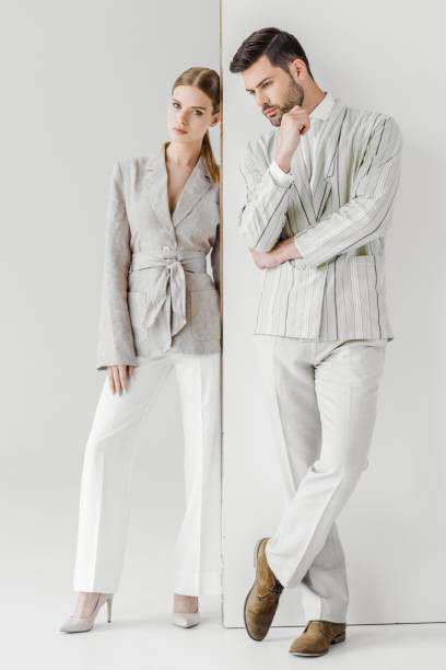 istock young male and female models in vintage jackets standing on white 991888018