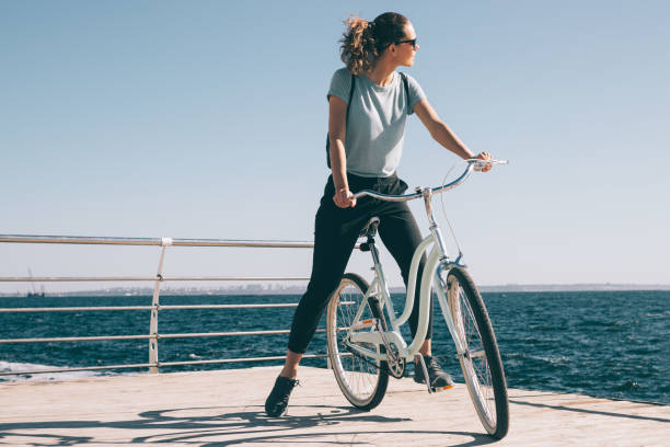 istock Slender young woman resting during bike 991888040