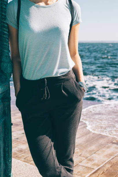 istock Stylish young woman standing 991888050