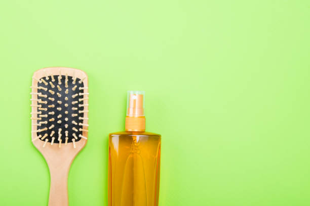 istock set of tools and items for combing hair, on a green background 991891274