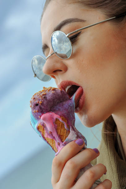 istock Woman licking ice cream 991892520