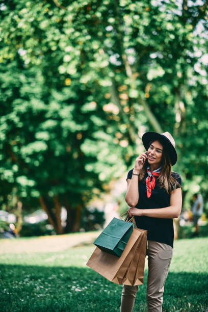 istock Portrait of woman using smart phone. 991892730