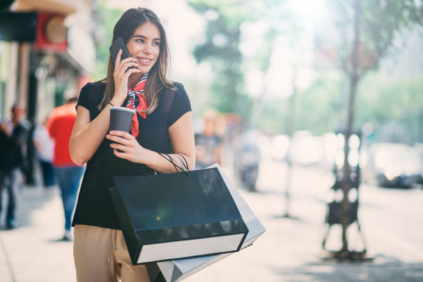 istock Woman walking down the street. 991892772