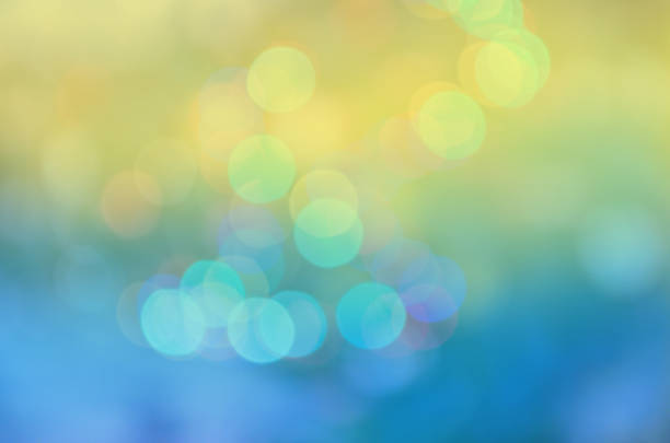 Natural bokeh background with sun rays. Blue sky and white clouds  bokeh backdrop. Abstract natural background. Copy space of summer vacation concept.