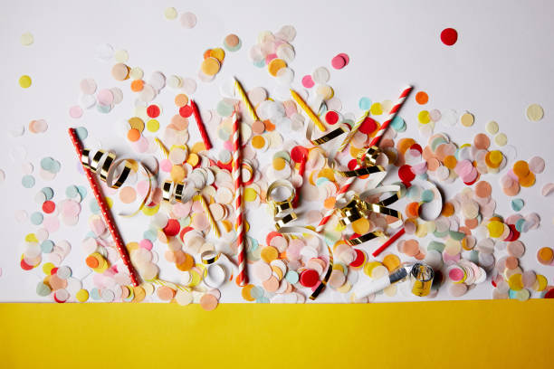 istock top view of confetti pieces and candles on white surface 991900162