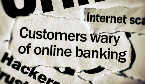 istock Newspaper headlines on computer crime and online banking 991903998