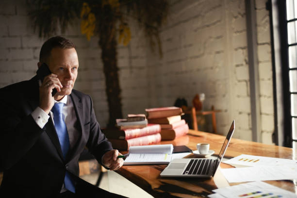 istock Businessman in coffee shop 991906896