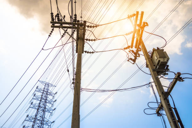 istock Electricity concept. Close up high voltage power lines station. 991924496