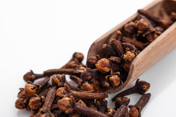 istock fragrant cloves on a white acrylic background 991964894