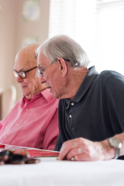 istock Senior men chatting over bingo game 991964978