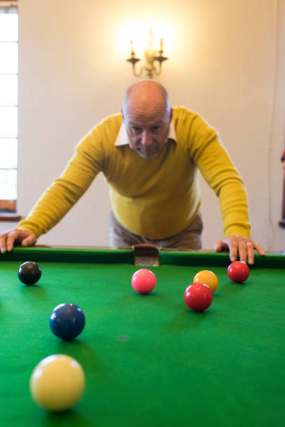 istock Medium shot of focused senior man leaning on snooker table 991966264
