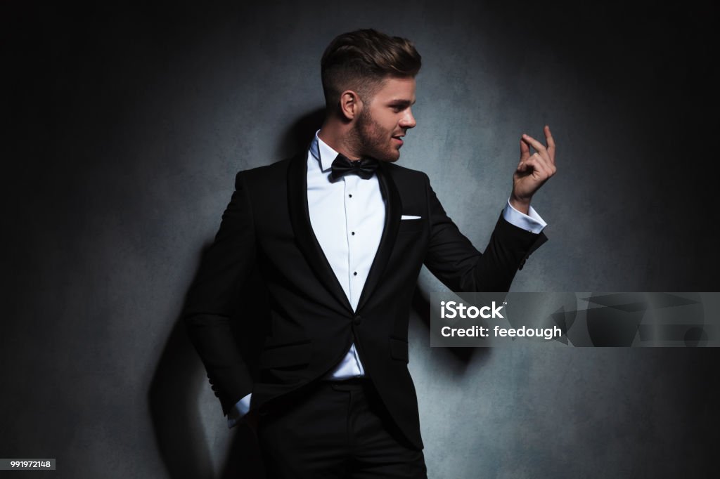 Portrait Of Formal Man Looking At Hand While Snapping Fingers Stock ...