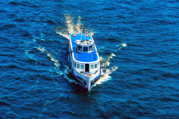 istock Great cruise boat in the blue sea - top view 991978112
