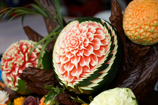 Beautifully Thai Hand carved fruits In Flower pattern.
