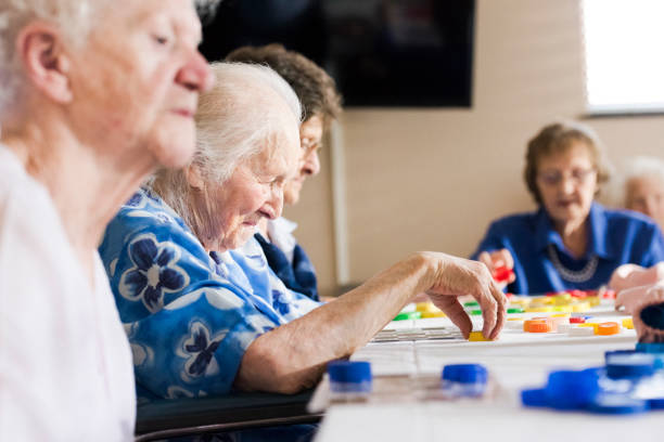 Senior ladies at a table playing bingo