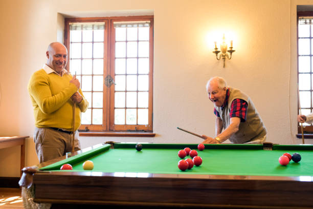 istock Carefree senior men playing snooker indoors 991979666