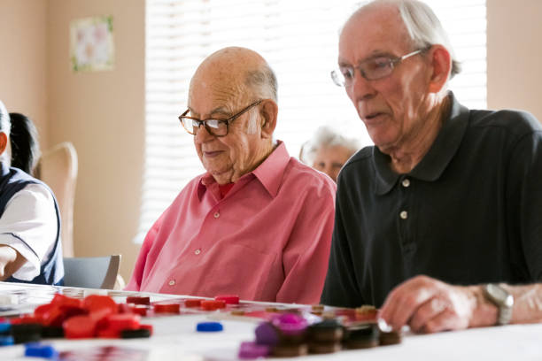 Senior men playing bingo in nursing home Senior men playing bingo in nursing home free bingo stock pictures, royalty-free photos & images