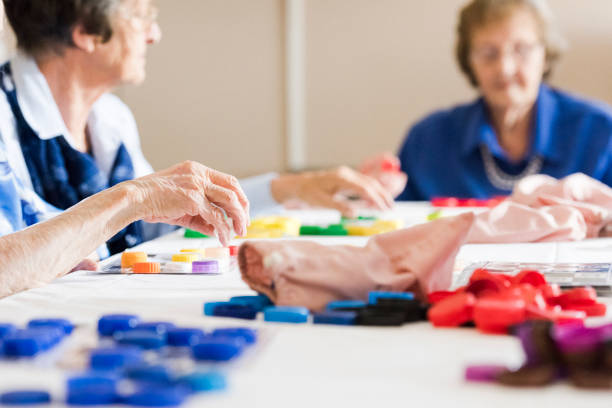 istock Low angle across senior playing at bingo table 991982718