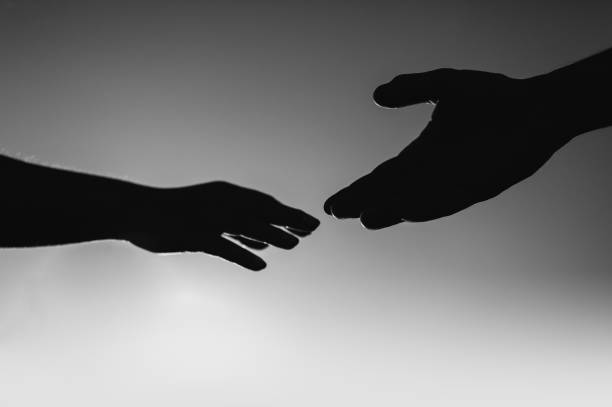 istock Silhouette of hands of lovers 991987172