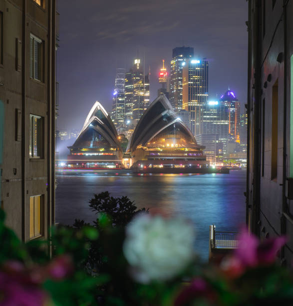 The illuminated opera house at night in a buildings framed, designs imagery, the beautiful iconic landmark of Australia, view from kirribilli point. Australia:01/04/18 stock photo