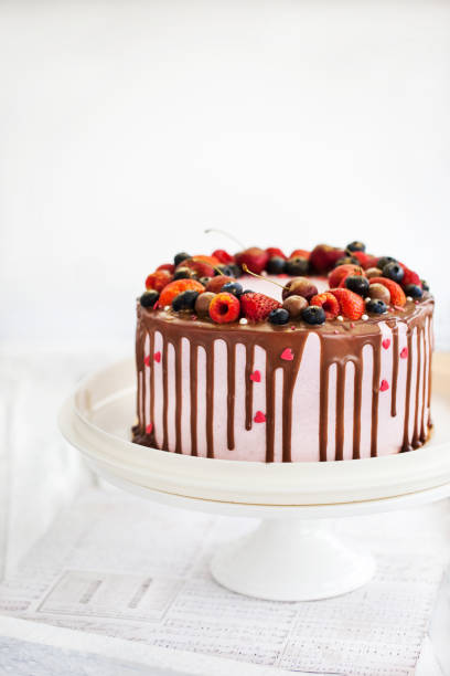 istock Delicious homemade cake decorated with chocolate and fresh berries 991994554