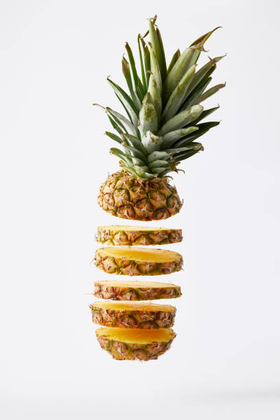 istock close up view of fresh cut pineapple exotic fruit isolated on white 991998394