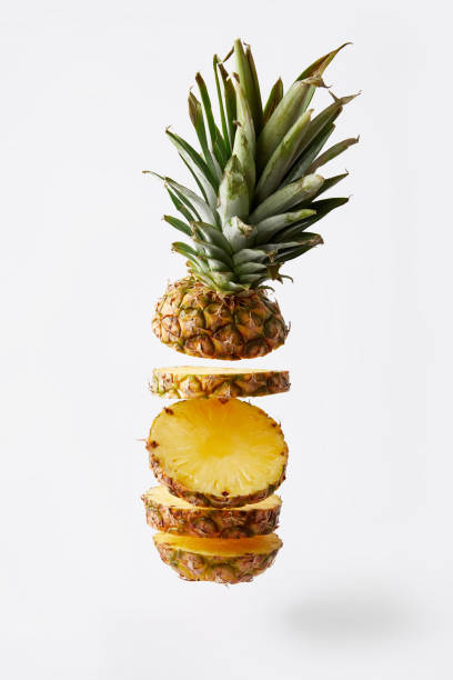 istock close up view of fresh cut pineapple exotic fruit isolated on white 991998590