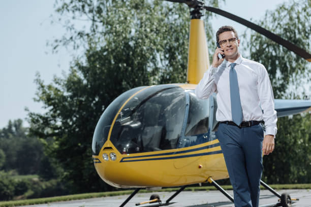 istock Pleasant young CEO talking on the phone at helipad 992005702