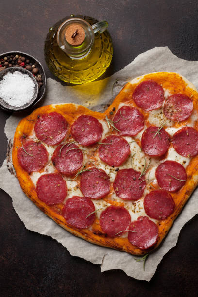 istock Heart shaped pizza with pepperoni 992008060