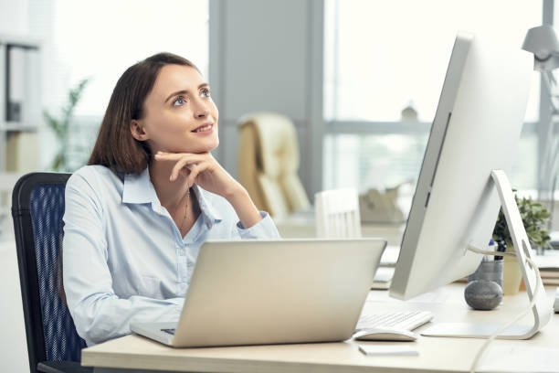 istock Dreaming businesswoman at working table 992017298