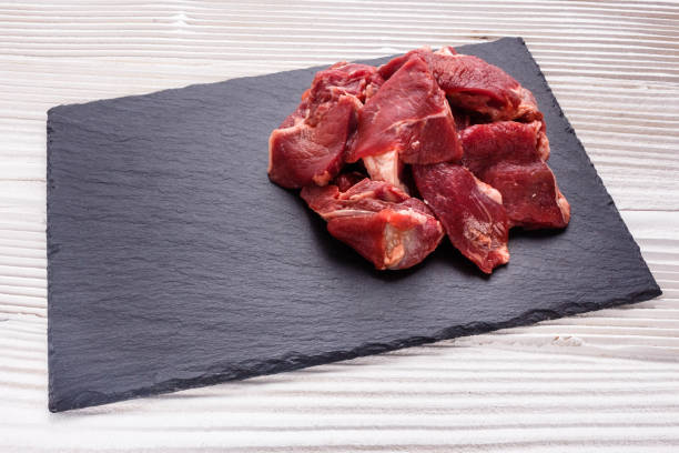 istock fresh lamb meat on a textured stone plate 992017420