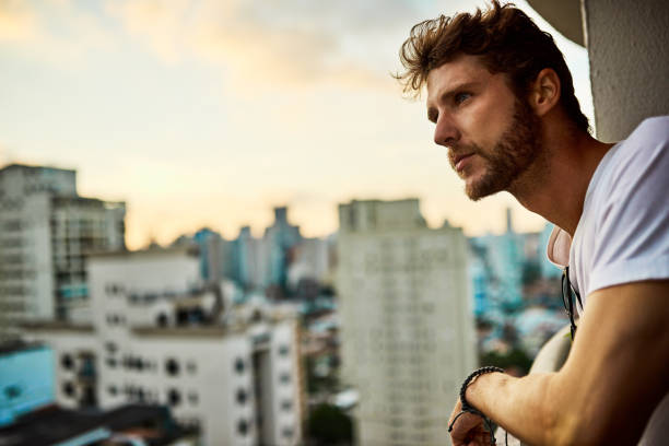 Shot of handsome young man enjoying the view of the city