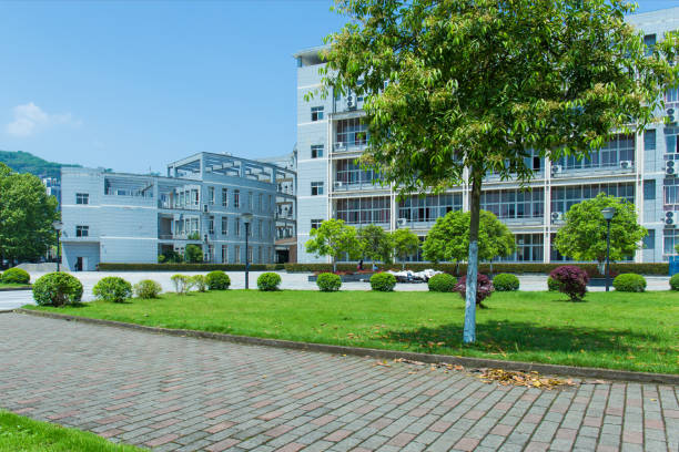 istock Modern university school buildings and public parks, trees, meadows and sidewalks 992023938