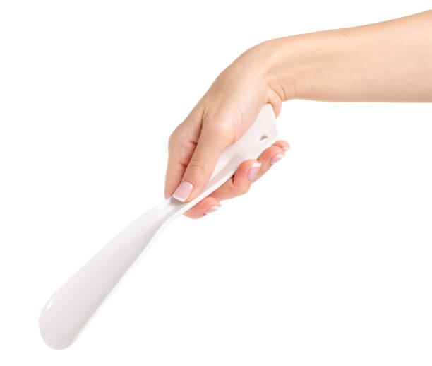 istock Spoon for shoes in hand 992024390