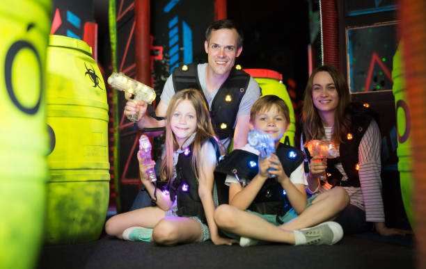 istock Family posing with laser pistols 992025192