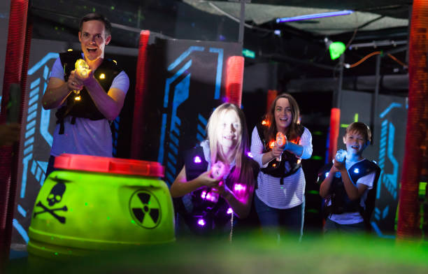 istock Kids and adults on lasertag arena 992025342