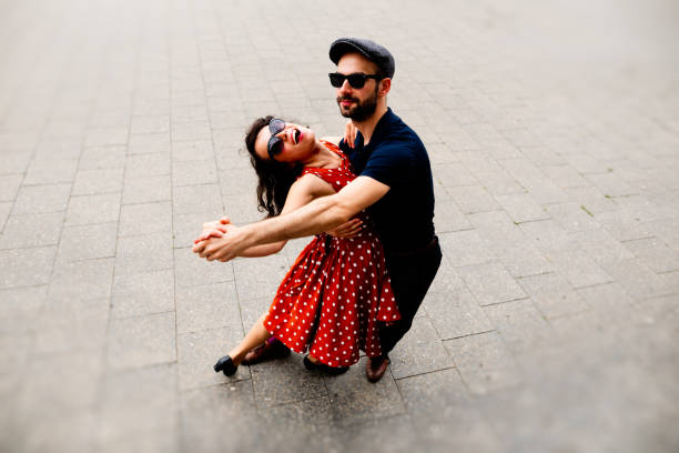 A beautiful couple dancing in the streets of Berlin A beautiful couple dancing in the streets of Berlin lindy hop stock pictures, royalty-free photos & images