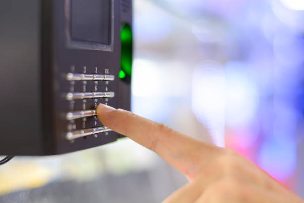 istock Finger print scan for unlock door security system, record office working time. 992028436