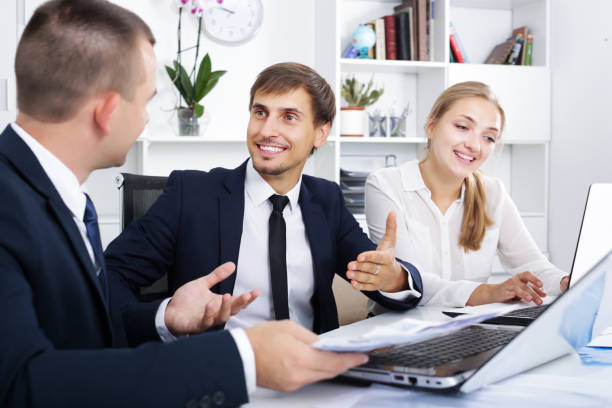 istock Coworkers chatting about business project 992032086