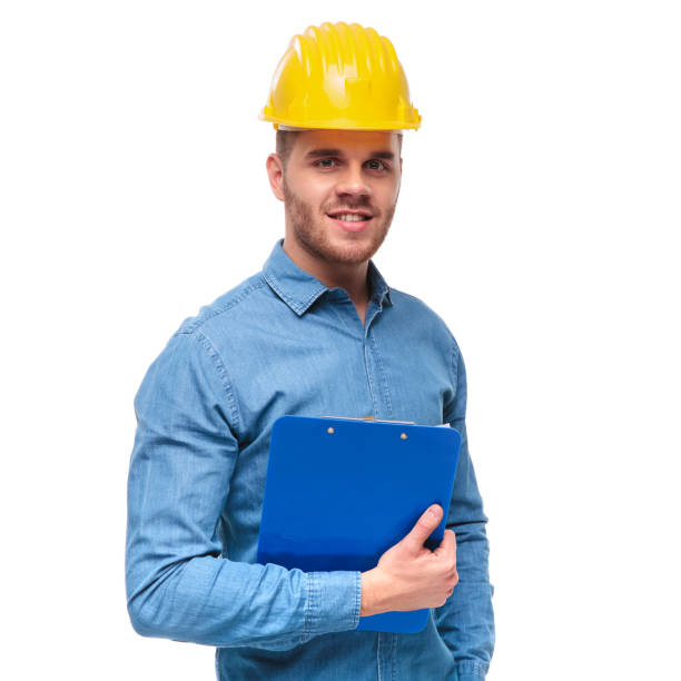 istock portrait of casual student engineer holding a blue clipboard 992032618