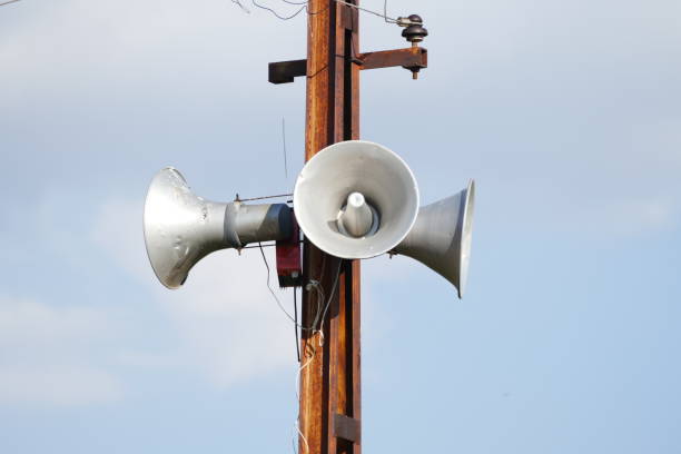 istock making announcements, audio speakers on the pole, 992032776